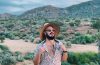 Andrew Lynn wearing a hat in the California desert.