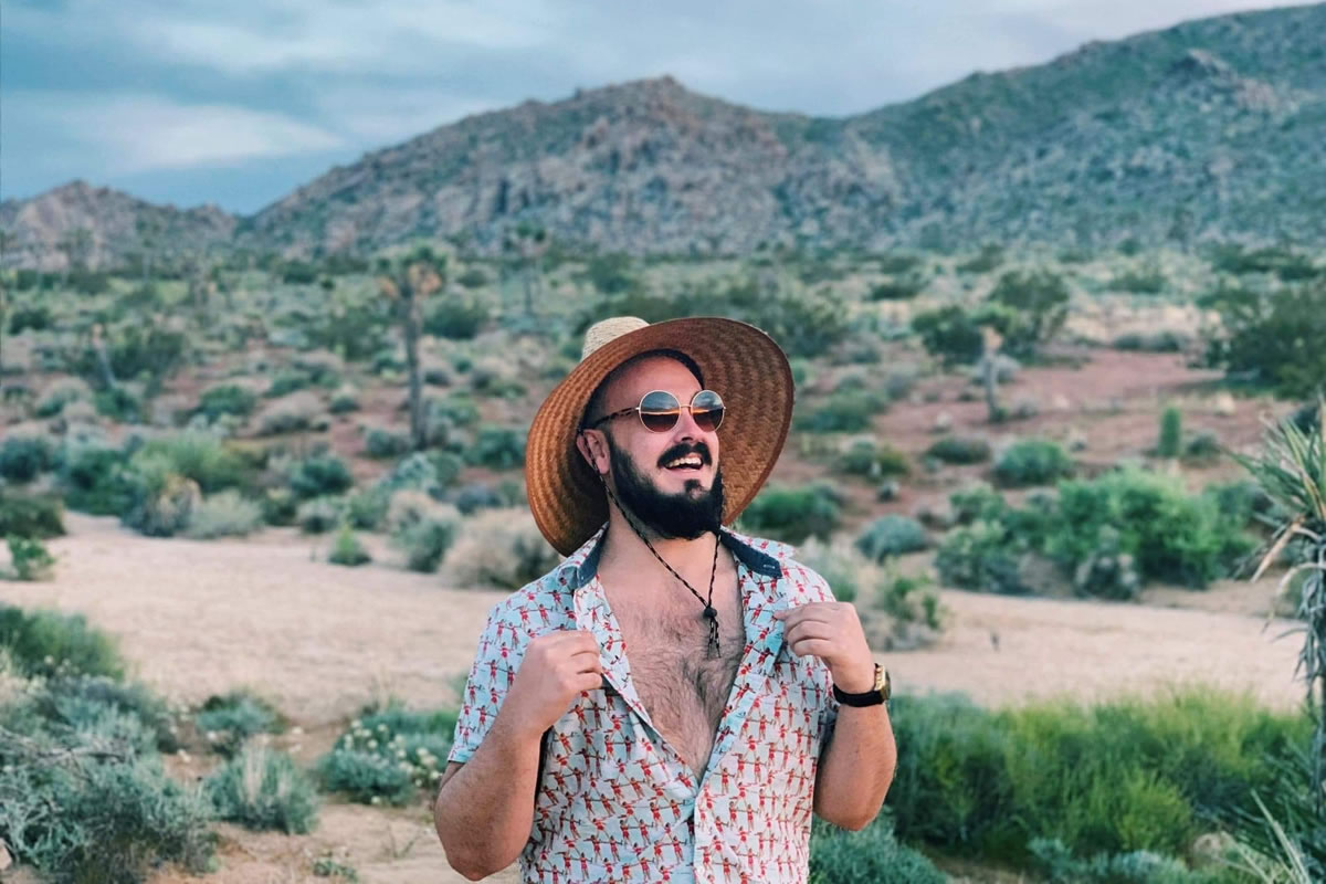 Andrew Lynn wearing a hat in the California desert.