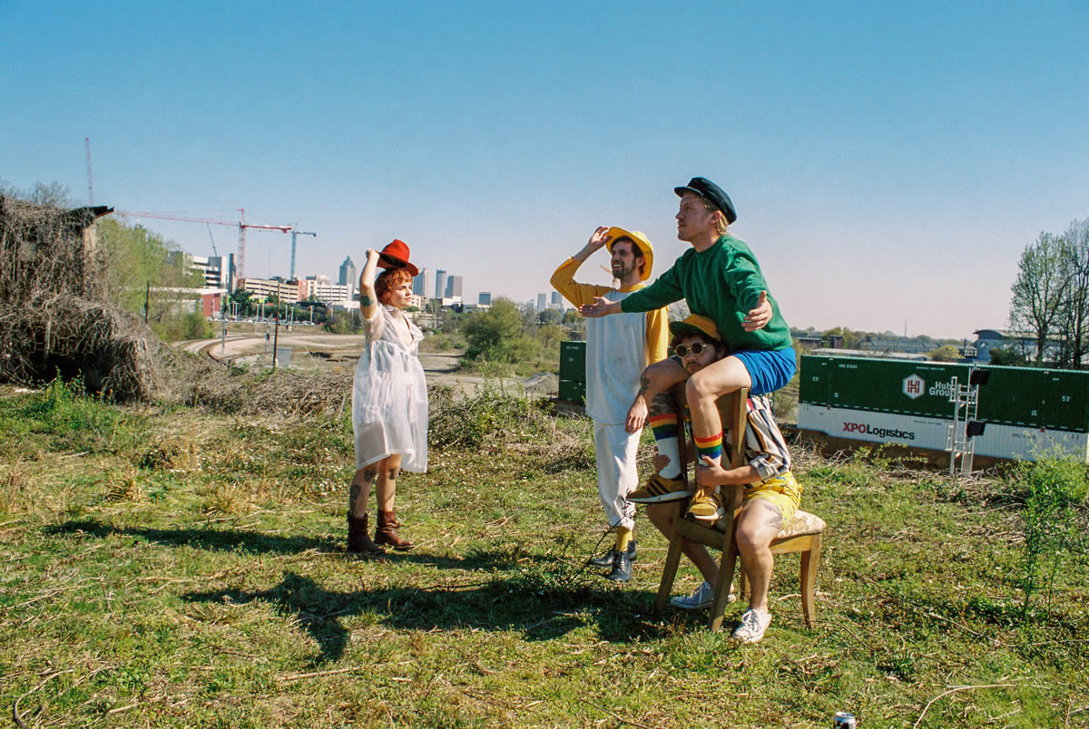 Chick Wallace in a field with Atlanta in the background.