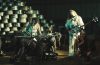 members of Dead Register on a sound stage performing with industrial backdrop.