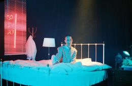 Matt Weiner sitting up in a bed