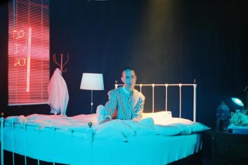 Matt Weiner sitting up in a bed