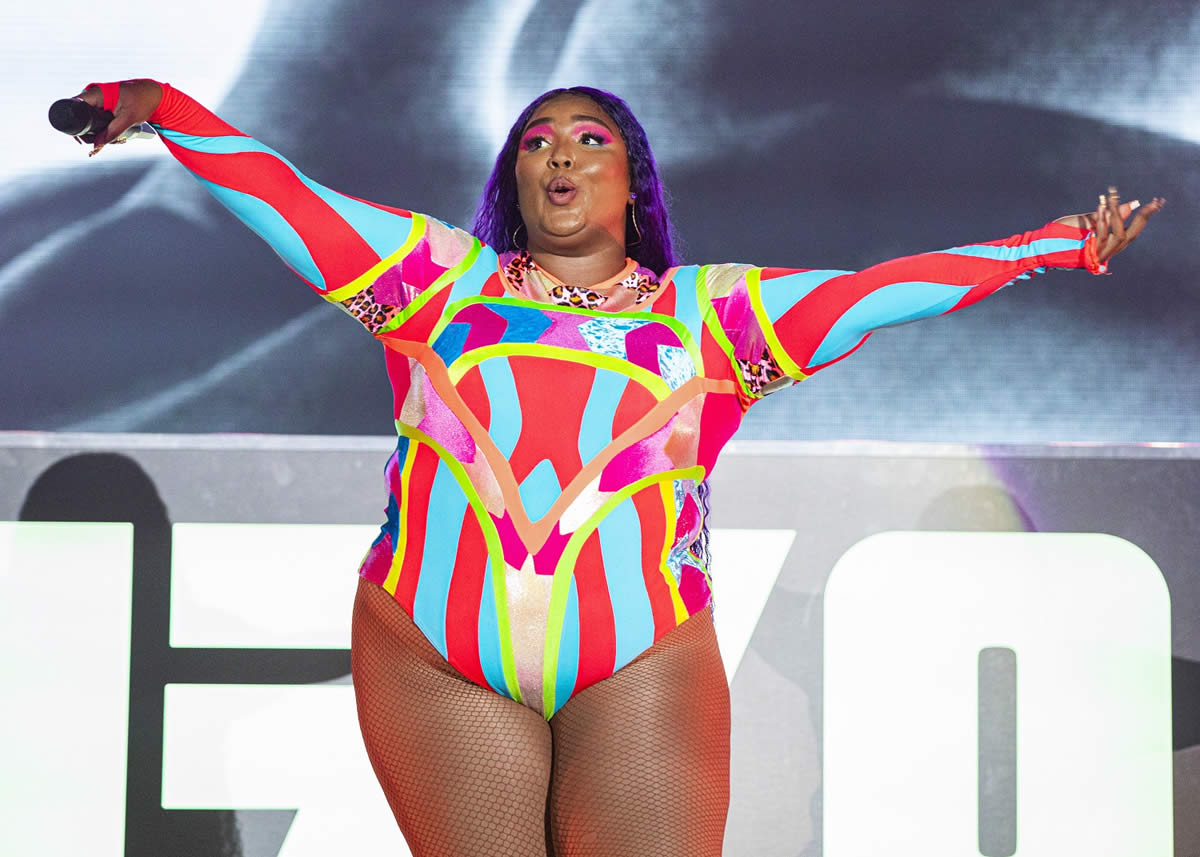 Lizzo with arms outstretched