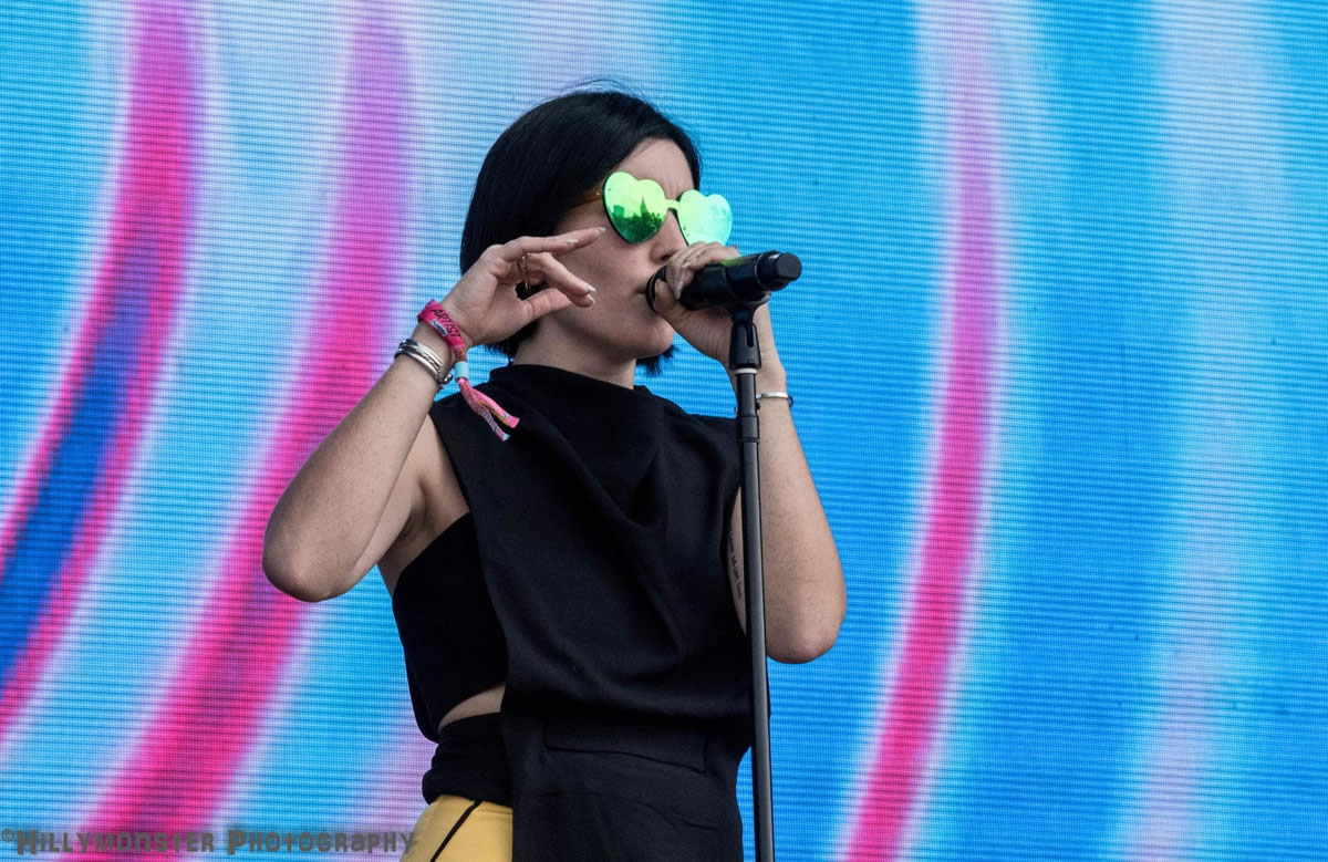 Singer of SHAED holding a microphone