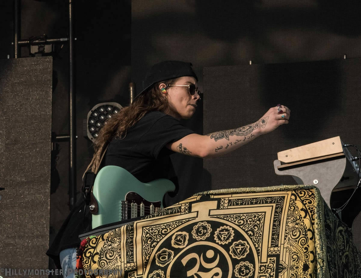 Tash Sultana creating a soundscape with guitar and keyboard.