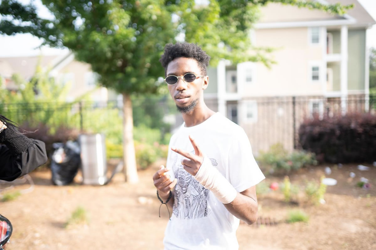 BOREGARD. holding up a peace sign