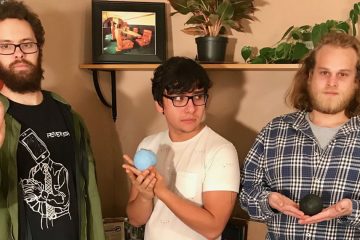 members of Dead Neighbors holding different balls