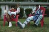 rapper BOREGARD and woman siting in chairs on front lawn