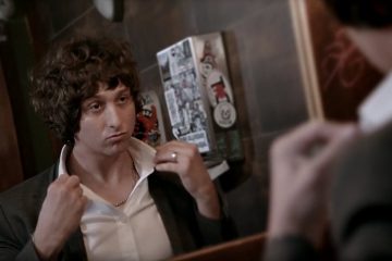 Rollingchild looking into a mirror and popping up his collar