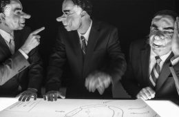 members of Victory Hands wearing Richard Nixon masks