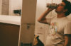 Justin Green of Mountain PArty drinking a Budweiser in the studio.