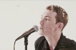 Stay Here vocalist singing into a microphone.