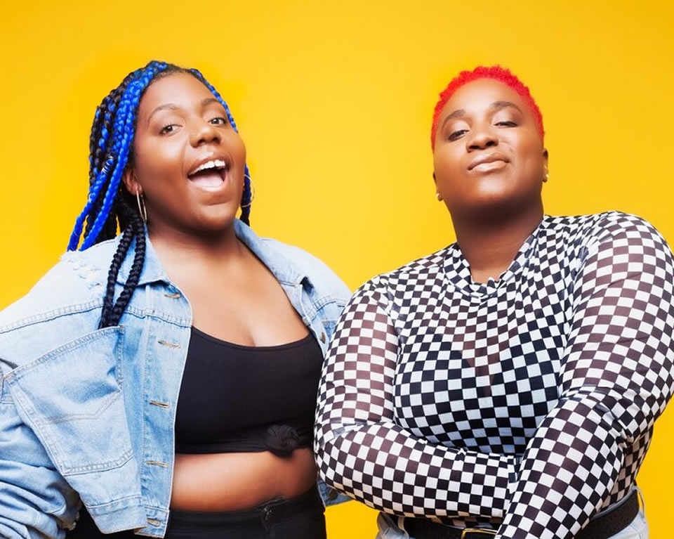 AUDIADASOUND and Rocket Rhonnie, also known as The Queendom in front of a yellow background