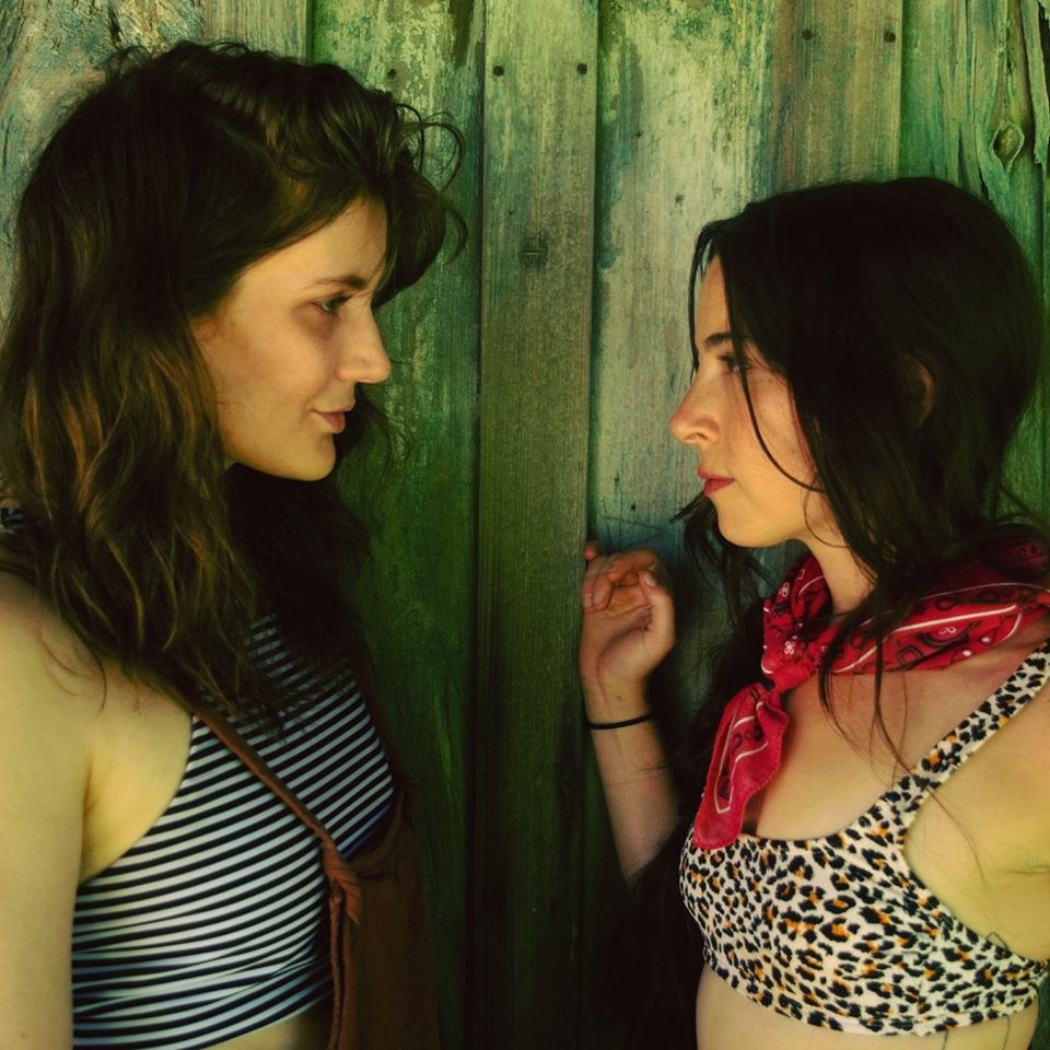 Brianna Bass and Kelsey Maridis lof Skunkweed Juju facing one another.