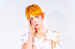 press photo of Klypi wearing white and elf ears