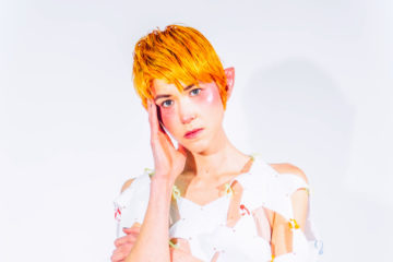 press photo of Klypi wearing white and elf ears