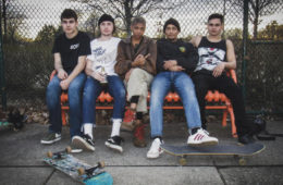 members of Upchuck sitting on a bench.
