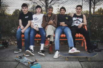 members of Upchuck sitting on a bench.