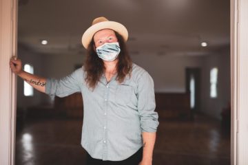 Damon Moon in doorway of new Standard Electric Recorders Co.