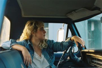 Jordan Reynolds of Rose Hotel sitting in a pickup truck