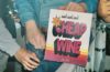 Man pouring wine out of a box that reads Cool Cool Cool Cheap Wine