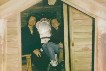 Tommy and Holyn Trautwein sitting in a small room with plain wooden walls