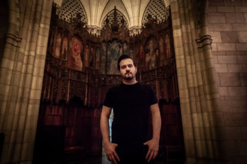 Ben Trickey standing in the entry of a cathedral