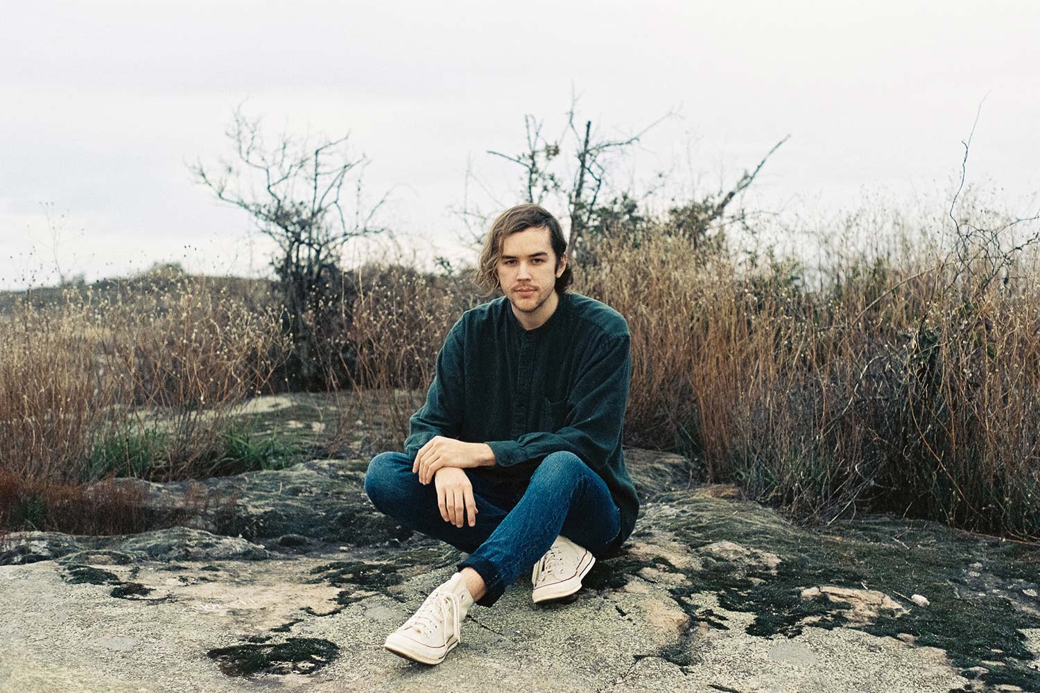 Austin Vos sitting in Arabia Mountain