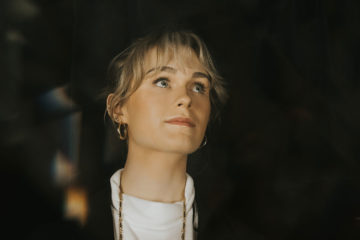 Annie Leeth wearing a white tee shirt
