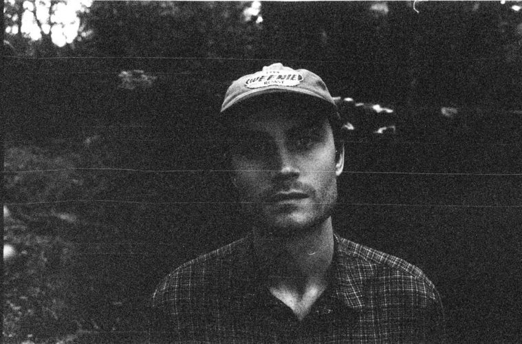 black and white photo of J J Posway of Sloping