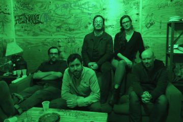 Members of Book Club sitting in a green room