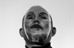 Ian Deaton wearing a silver mask