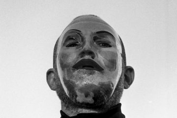 Ian Deaton wearing a silver mask