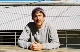 Philip Brantley of Terminally Phil wearing gray sweater with hands clasped