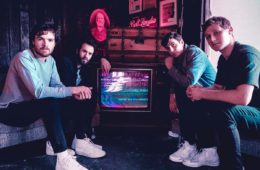 Members of Walden sitting around a television
