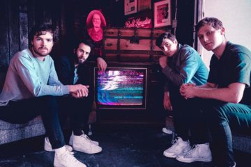 Members of Walden sitting around a television
