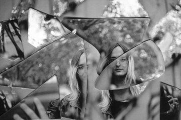 black and white press photo of mallbangs