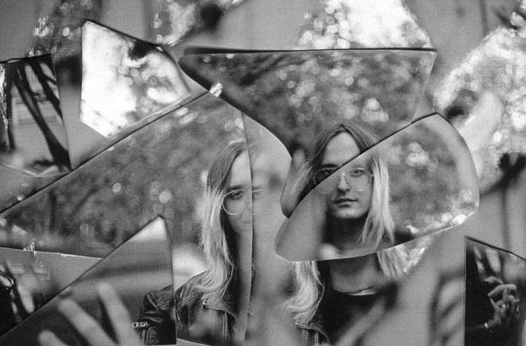 black and white press photo of mallbangs