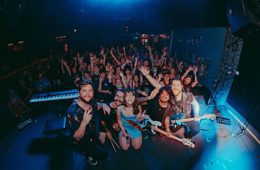 glimmers posing in front of a sold-out crowd in Purgatory at the Masquerade