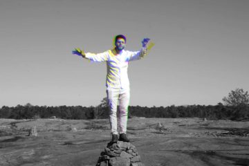 Alex Lotito standing on a rock on Arabia Mountain