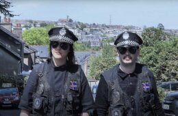 Seersha and Thorisson wear police uniforms in Cork, Ireland