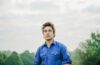 Eliot Bronson wearing a blue shirt