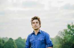 Eliot Bronson wearing a blue shirt