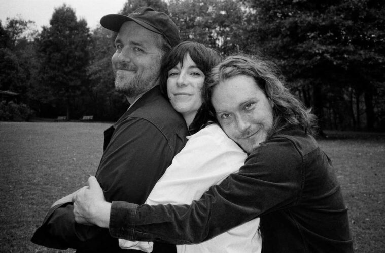 members of Bizner hugging one another