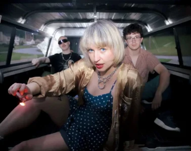 Members of punk band SMALL in the back of a truck