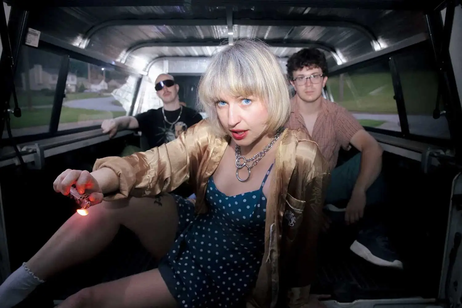Members of punk band SMALL in the back of a truck